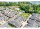 Features community amenities: pool, pickleball court, pond, and manicured lawns in an aerial view at 2334 Sylvia Ct, Denver, NC 28037