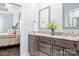 Bathroom featuring double vanity with granite countertop and a decorative vase at 2334 Sylvia Ct, Denver, NC 28037