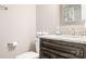 Bathroom featuring a vanity with granite countertop, dark wood cabinets, and a toilet at 2334 Sylvia Ct, Denver, NC 28037
