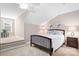 Comfortable bedroom featuring a bed, nightstand, and a cozy seating area with a large window at 2334 Sylvia Ct, Denver, NC 28037