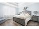 Comfortable bedroom featuring tray ceiling and stylish decor at 2334 Sylvia Ct, Denver, NC 28037