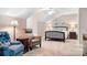 Cozy bedroom with sloped ceilings, a ceiling fan, and comfortable seating with coordinated lamps at 2334 Sylvia Ct, Denver, NC 28037