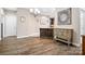 Spacious dining area featuring hardwood floors, chandelier, and access to kitchen at 2334 Sylvia Ct, Denver, NC 28037