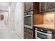 Modern kitchen featuring built-in microwave and oven and granite countertops at 2334 Sylvia Ct, Denver, NC 28037