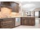 Well-equipped kitchen featuring custom cabinets, granite counters, and modern appliances at 2334 Sylvia Ct, Denver, NC 28037