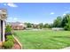 Expansive community green space and well-maintained landscaping under a clear blue sky at 2334 Sylvia Ct, Denver, NC 28037