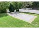 Outdoor pickleball court with a white fence, net, and lush green grass surrounds the court at 2334 Sylvia Ct, Denver, NC 28037