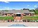 Community pool with beautiful landscaping, brick fencing and stairs leading to the bath house at 2334 Sylvia Ct, Denver, NC 28037