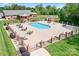 Community swimming pool with tables, chairs, lounge seating and meticulously maintained landscaping at 2334 Sylvia Ct, Denver, NC 28037