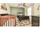 Charming bedroom with a geometric accent wall, stylish decor, and inviting atmosphere at 235 Whispering Hills Dr, Locust, NC 28097
