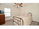 A bedroom with a comfortable bed, ample natural light, and minimalist decor at 235 Whispering Hills Dr, Locust, NC 28097