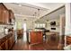 Modern kitchen featuring stainless steel appliances, a center island with seating, and a view of the open living area at 235 Whispering Hills Dr, Locust, NC 28097