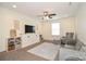 Cozy living room space with built-in entertainment center, ceiling fan and comfortable seating at 235 Whispering Hills Dr, Locust, NC 28097