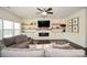 Stylish living room features a large flat-screen television, built-in shelving, and comfortable sofas at 235 Whispering Hills Dr, Locust, NC 28097