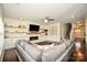 Spacious living room showcases hardwood floors, a modern fireplace, and comfortable seating at 235 Whispering Hills Dr, Locust, NC 28097