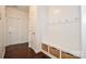 Inviting mudroom with bench seating, storage drawers, and a coat rack for organization at 235 Whispering Hills Dr, Locust, NC 28097