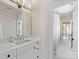 Well-lit bathroom boasts a white vanity, modern fixtures, and tiled floors leading to more rooms at 2500 Marshall Pl, Charlotte, NC 28203