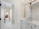 Bright bathroom features a large mirror, modern lighting, and doorway to a shower and more rooms at 2500 Marshall Pl, Charlotte, NC 28203