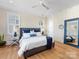 Comfortable bedroom with hardwood floors, neutral colors, and ample natural light at 2500 Marshall Pl, Charlotte, NC 28203