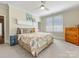 Inviting bedroom features a ceiling fan, neutral carpet, and ample natural light from the window at 2500 Marshall Pl, Charlotte, NC 28203