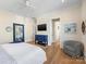 Airy bedroom features light hardwood floors and matching dresser at 2500 Marshall Pl, Charlotte, NC 28203