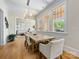 Elegant dining room featuring a large wood table, open to the living area with abundant natural light at 2500 Marshall Pl, Charlotte, NC 28203
