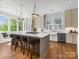 Spacious kitchen with a large island, barstool seating, and stainless steel appliances at 2500 Marshall Pl, Charlotte, NC 28203