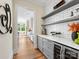 Modern kitchen with beverage cooler, wine storage, white subway tile backsplash, and storage at 2500 Marshall Pl, Charlotte, NC 28203