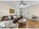 This living room features hardwood floors, leather sofa, ceiling fan, and natural lighting at 2500 Marshall Pl, Charlotte, NC 28203