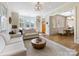 Open living room with hardwood floors, stylish decor, and a seamless flow to dining and entry areas at 2500 Marshall Pl, Charlotte, NC 28203