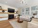Inviting living room showcasing a fireplace, mounted TV, and comfortable seating bathed in natural light at 2500 Marshall Pl, Charlotte, NC 28203