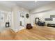 Bright living space with hardwood floors, laundry room access, and comfortable seating area at 2500 Marshall Pl, Charlotte, NC 28203
