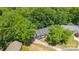 Aerial view of a charming home nestled among lush trees, featuring a driveway and well-maintained landscaping at 2848 Briar Ridge Dr, Charlotte, NC 28270