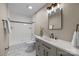 Bathroom with bathtub and shower, a single sink vanity, and updated fixtures at 2848 Briar Ridge Dr, Charlotte, NC 28270