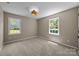 Neutral bedroom with two windows and carpet at 2848 Briar Ridge Dr, Charlotte, NC 28270