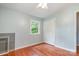 This bedroom features hardwood floors, a window providing natural light, and a double door closet for plenty of storage at 302 Kimberlee Dr, Shelby, NC 28152