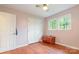 A bright bedroom featuring hardwood floors, closet doors, and windows to bring in natural light at 302 Kimberlee Dr, Shelby, NC 28152