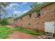 Brick exterior of the home, featuring small windows along the back and side yard views at 302 Kimberlee Dr, Shelby, NC 28152