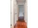 Hallway featuring hardwood floors and white doors leading to other rooms at 302 Kimberlee Dr, Shelby, NC 28152