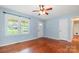 Inviting living room with hardwood floors, a ceiling fan, and natural light from large windows at 302 Kimberlee Dr, Shelby, NC 28152