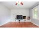 Light-filled living room featuring hardwood floors and a brick fireplace at 302 Kimberlee Dr, Shelby, NC 28152