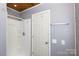 Practical bathroom featuring a shower, white walls, a white door, and basic fixtures, ensuring functionality at 311 Airport Rd, Rock Hill, SC 29732