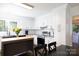 Modern kitchen with white cabinetry, stainless steel appliances, and an island, creating a sleek and functional cooking space at 311 Airport Rd, Rock Hill, SC 29732