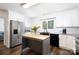 Modern kitchen features an island, stainless steel appliances, white cabinets, and granite countertops, a chef's delight at 311 Airport Rd, Rock Hill, SC 29732