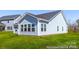 Exterior view of a light blue home with a gray roof and a green lawn at 355 Gray Wolf St # 122P, China Grove, NC 28023