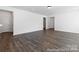 An open-concept living room featuring hardwood floors and neutral wall colors at 355 Gray Wolf St # 122P, China Grove, NC 28023