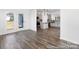 Bright living room featuring hardwood floors and kitchen view with stainless steel appliances at 355 Gray Wolf St # 122P, China Grove, NC 28023