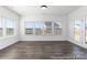 Bright living room with large windows, hardwood floors, and ample natural light at 355 Gray Wolf St # 122P, China Grove, NC 28023