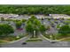 Aerial view of a shopping center with ample parking and a variety of retail stores and restaurants at 3619 Chilham Pl, Charlotte, NC 28226