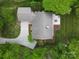 Aerial view showcasing the home's layout with a large yard, patio, driveway, and landscaping at 3619 Chilham Pl, Charlotte, NC 28226
